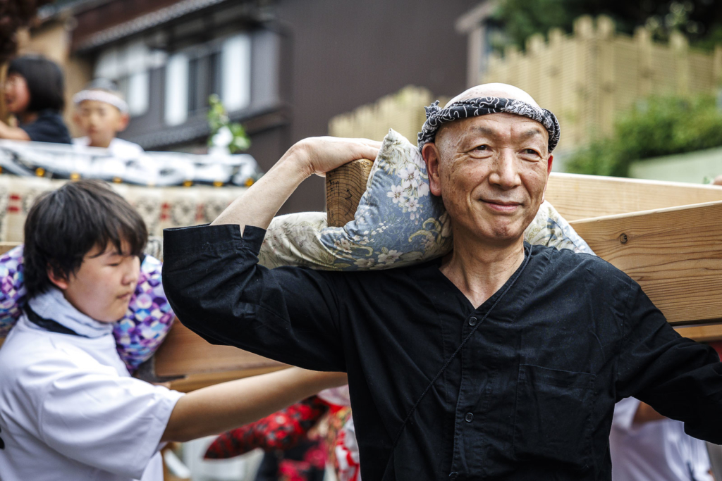 Man carrying Kiriko lantern float