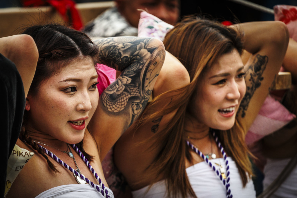 Two girls carrying Kiriko lantern float